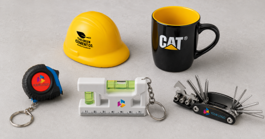 Branded promotional merchandise for construction companies including a hard hat stress toy, tape measure keyring, spirit level keyring, multi tool and mug from Style Brands UK