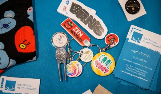 Style branding merchandise business cards and event merchandise on table at an event